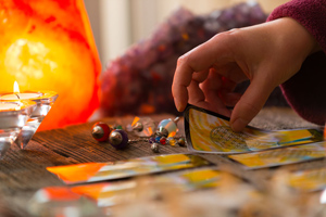 Tarot Cards laid out on a table with candles